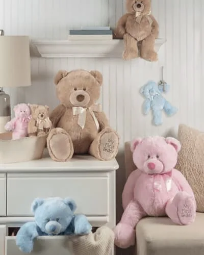 Charming child's room adorned with adorable light blue, light pink, and brown stuffed teddy bears.